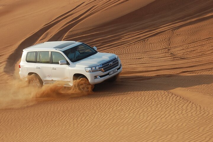 Experience the thrill of navigating Dubai's stunning dunes in a luxury 4X4 where adventure meets the breathtaking beauty of the desert landscape. Indulge in a memorable BBQ dinner under the stars.